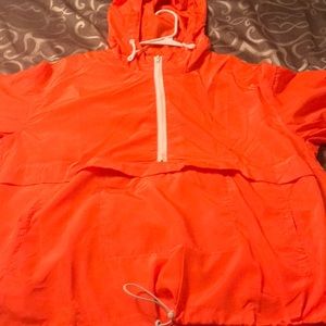 Bright orange windbreaker